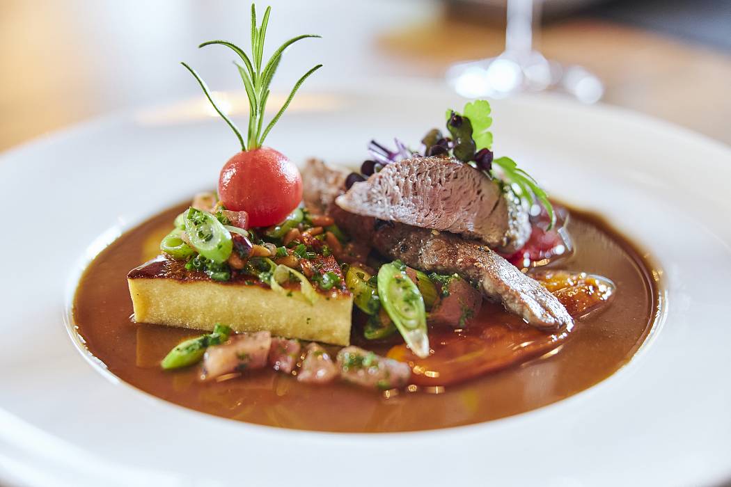 Meat dish nicely arranged on a white plate