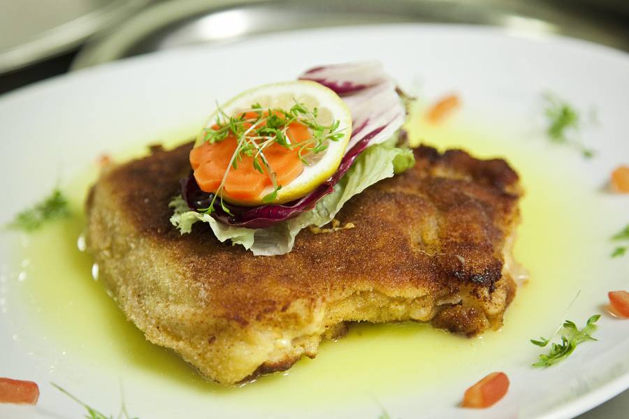 Portion of German asparagus with a small breaded schnitzel